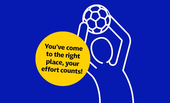 A figure catches a soccer ball.