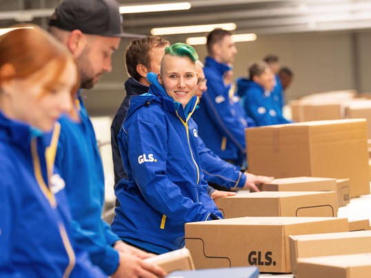 Employees sort parcels